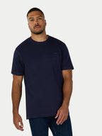 Man wearing a navy blue t-shirt on a white background