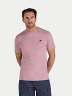 Man wearing a pink t-shirt with a logo on a white background