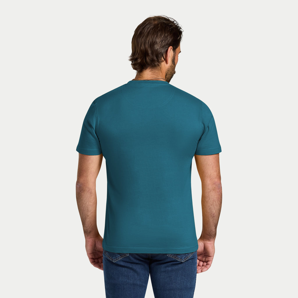 Man wearing a teal t-shirt on a white background