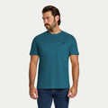 Man wearing a teal t-shirt on a white background