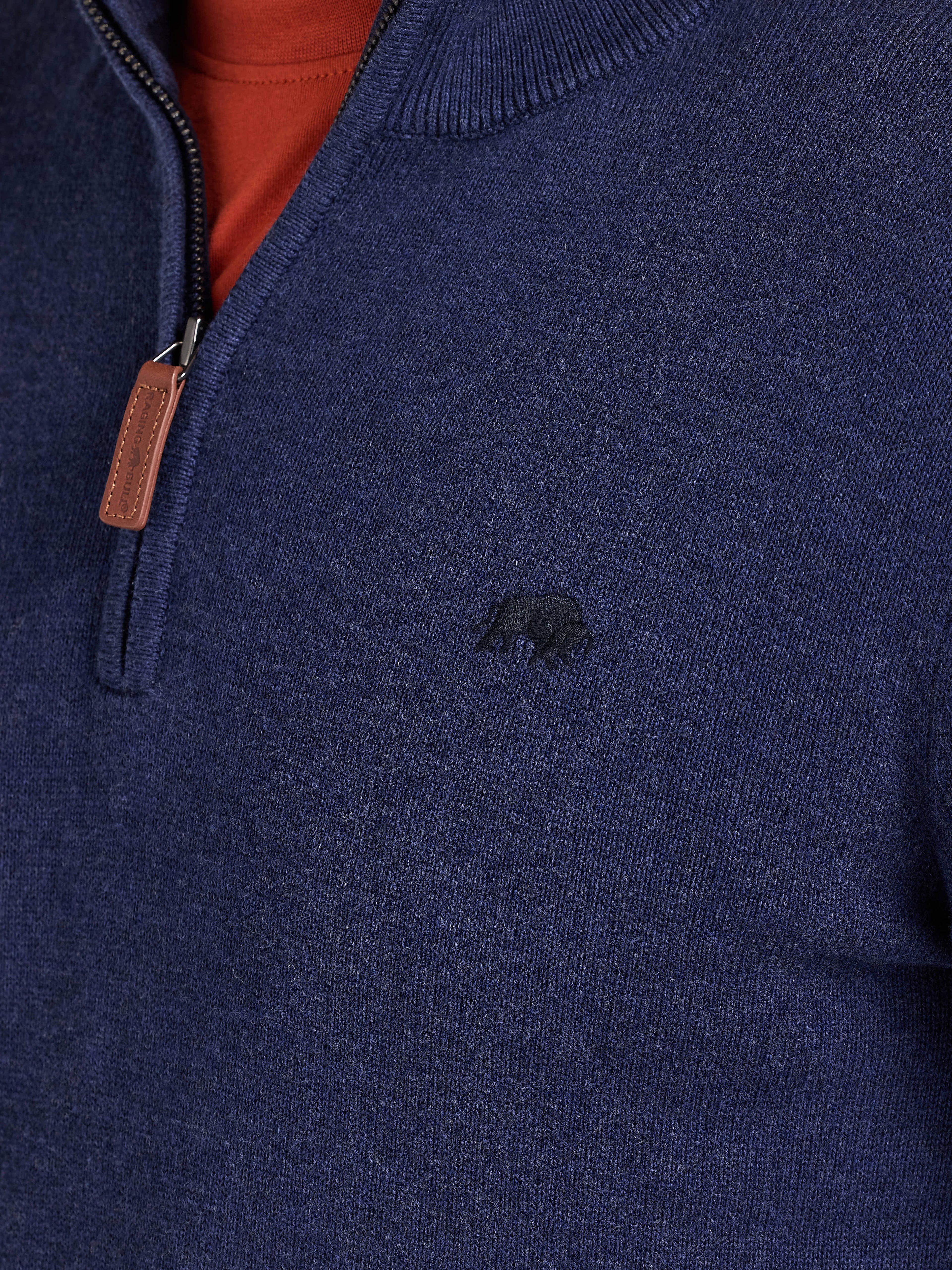 Navy blue sweater with a small logo on the chest