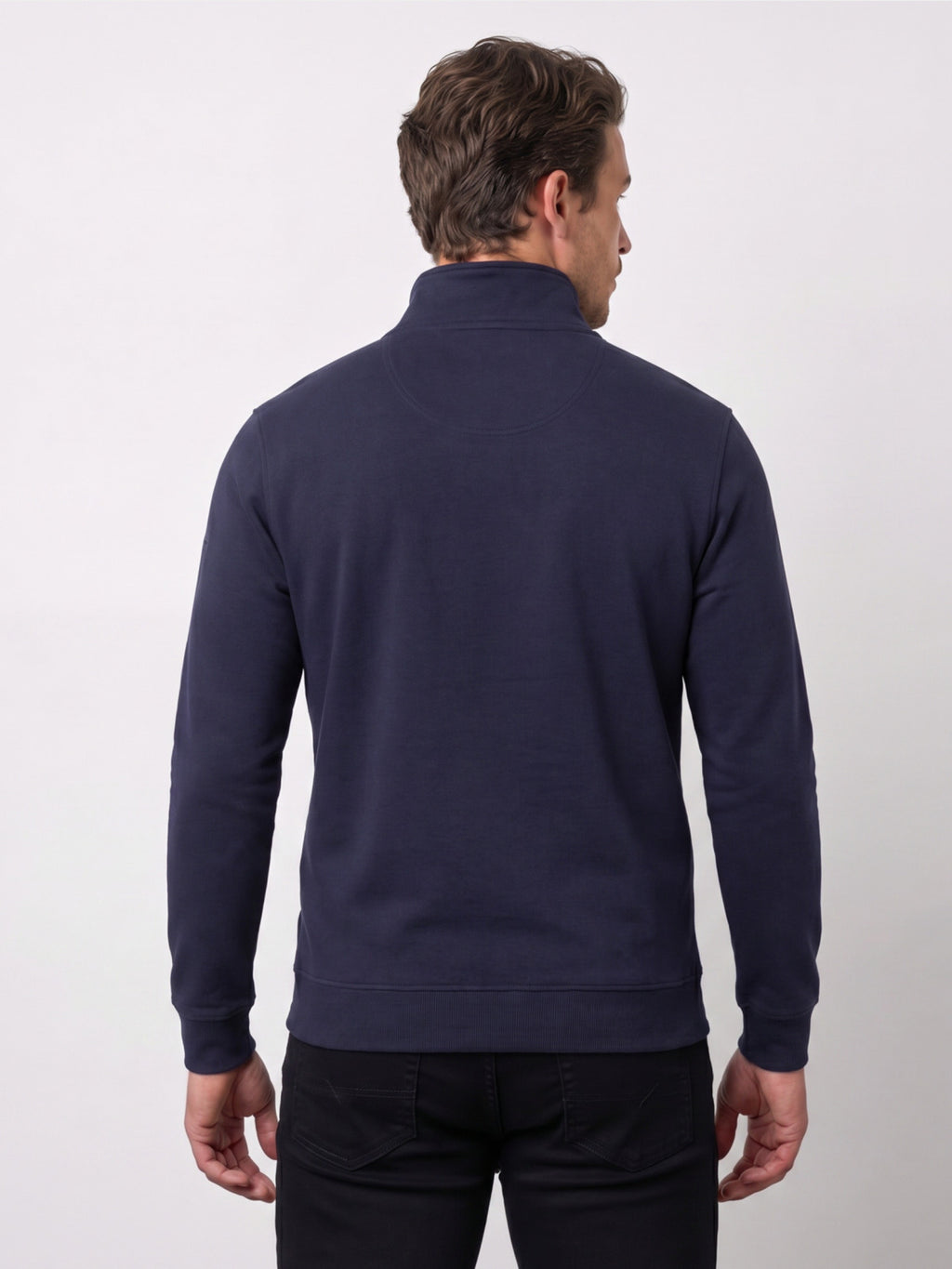 Man wearing a navy blue quarter-zip sweatshirt on a white background