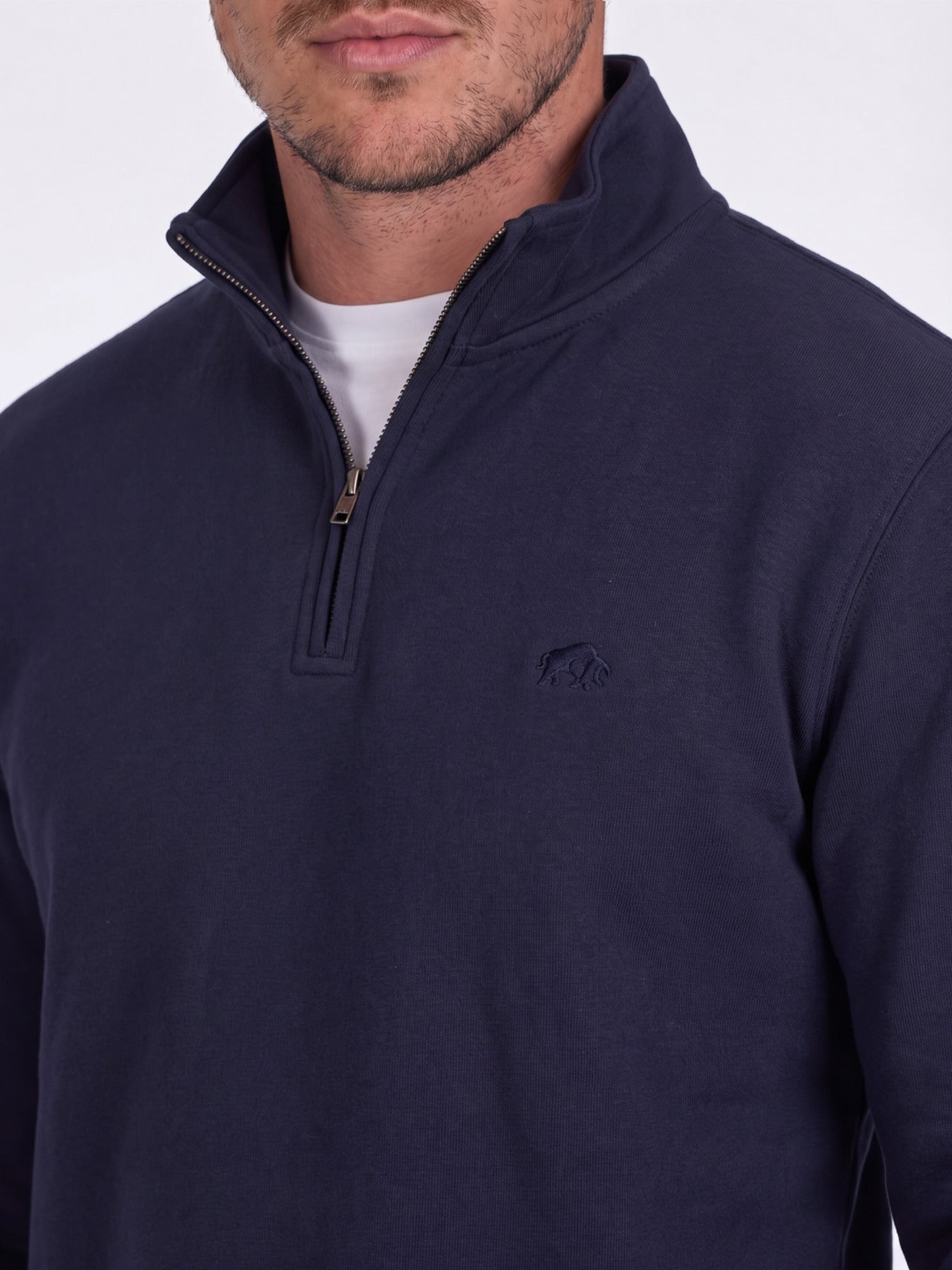 Navy blue pullover with a logo on the chest against a white background
