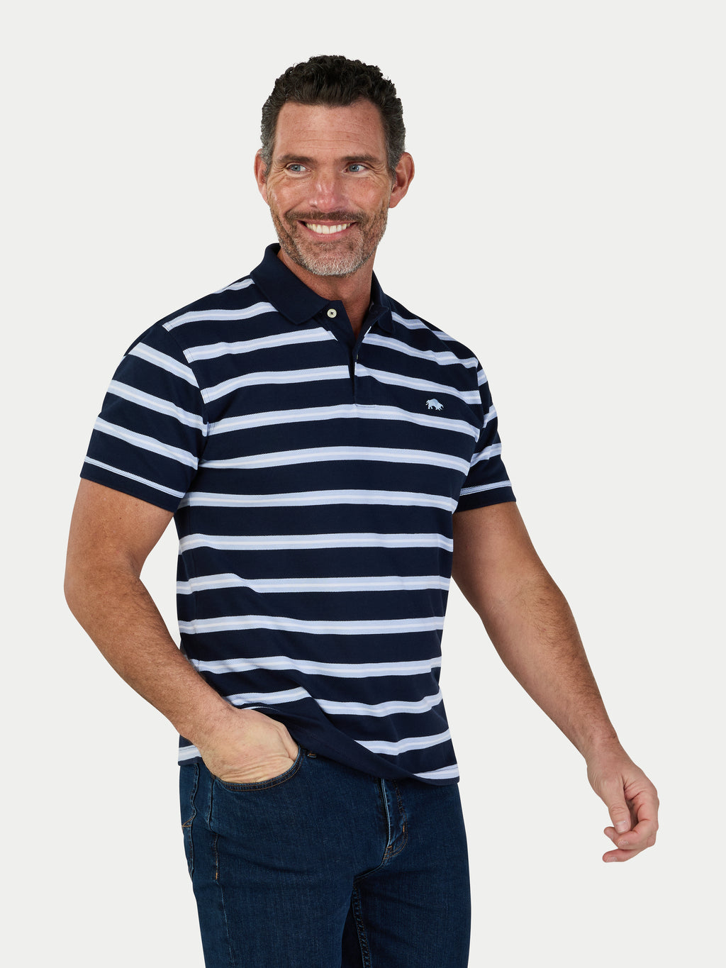 Man wearing a navy and white striped polo shirt on a light gray background