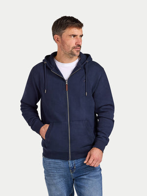 Man wearing a navy blue hoodie with a white background