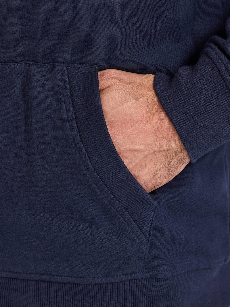 Navy blue sweatshirt with a hand inserted into the pocket