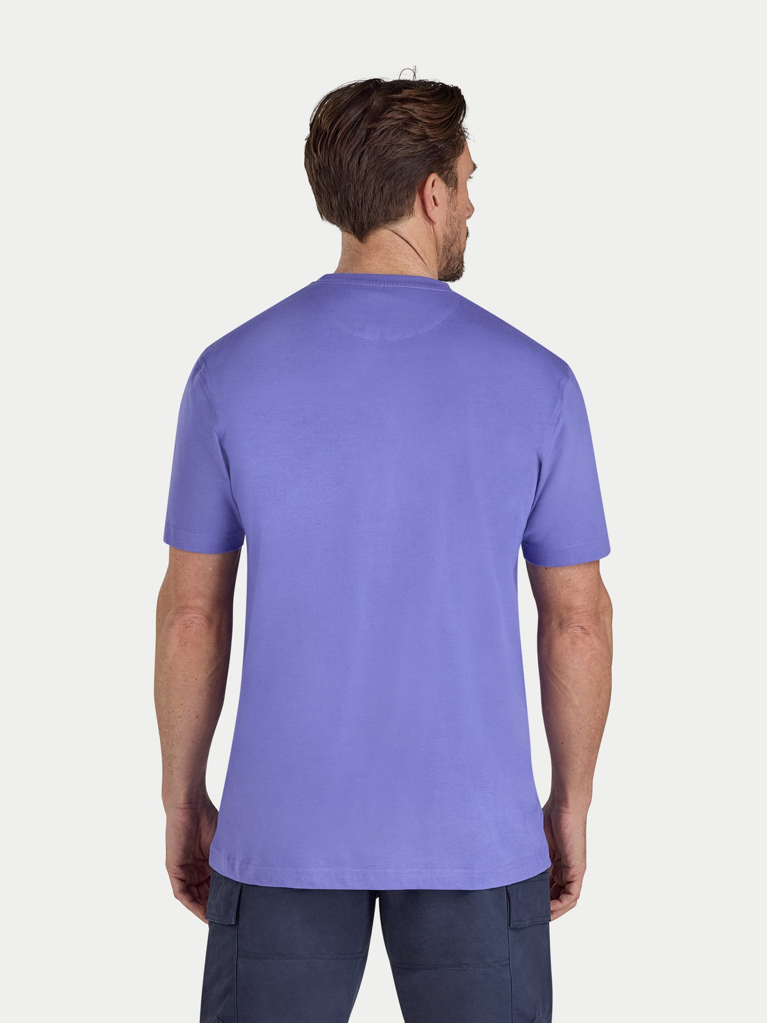Man wearing a purple t-shirt on a white background
