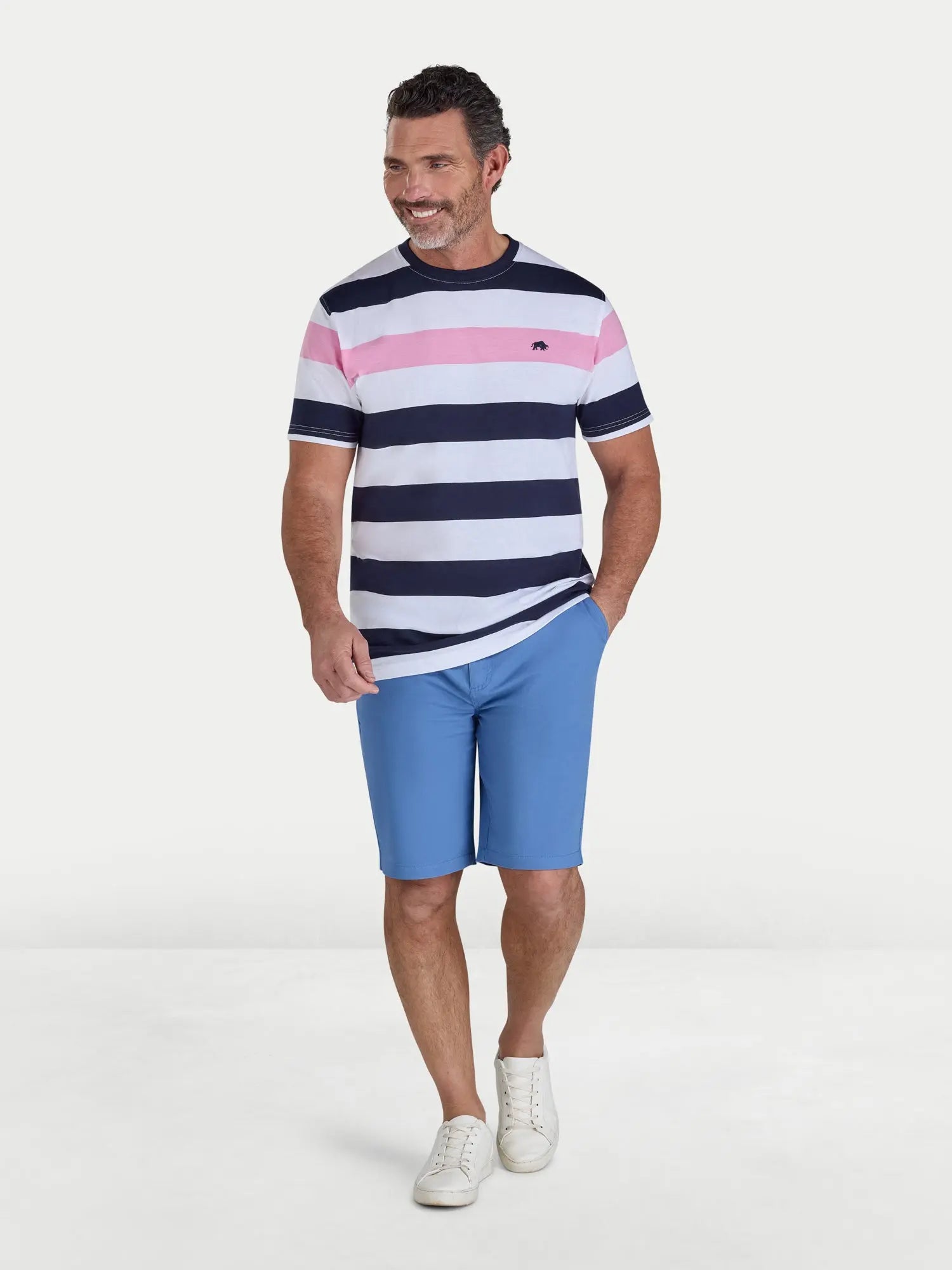 Man wearing a striped shirt and blue shorts on a white background