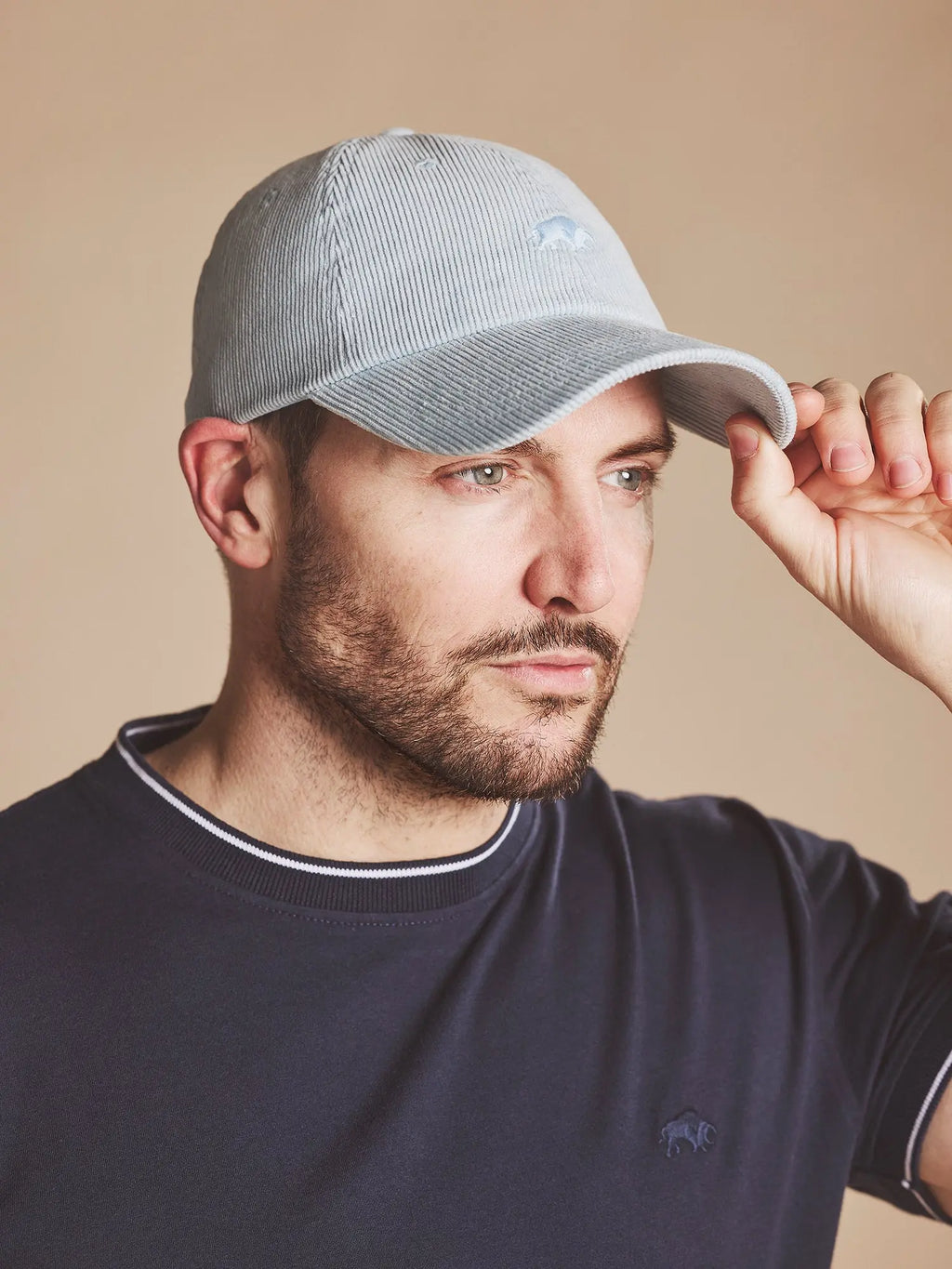 Man wearing a Raging Bull Corduroy cap in Blue, front. 