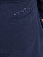 Navy blue sweatpants with 'Raging Bull' logo on pocket