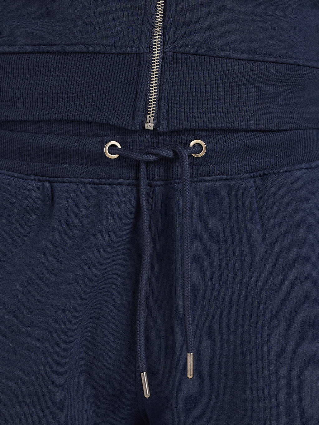 Navy blue sweatpants with drawstring and zipper detail