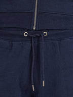 Navy blue sweatpants with drawstring and zipper detail