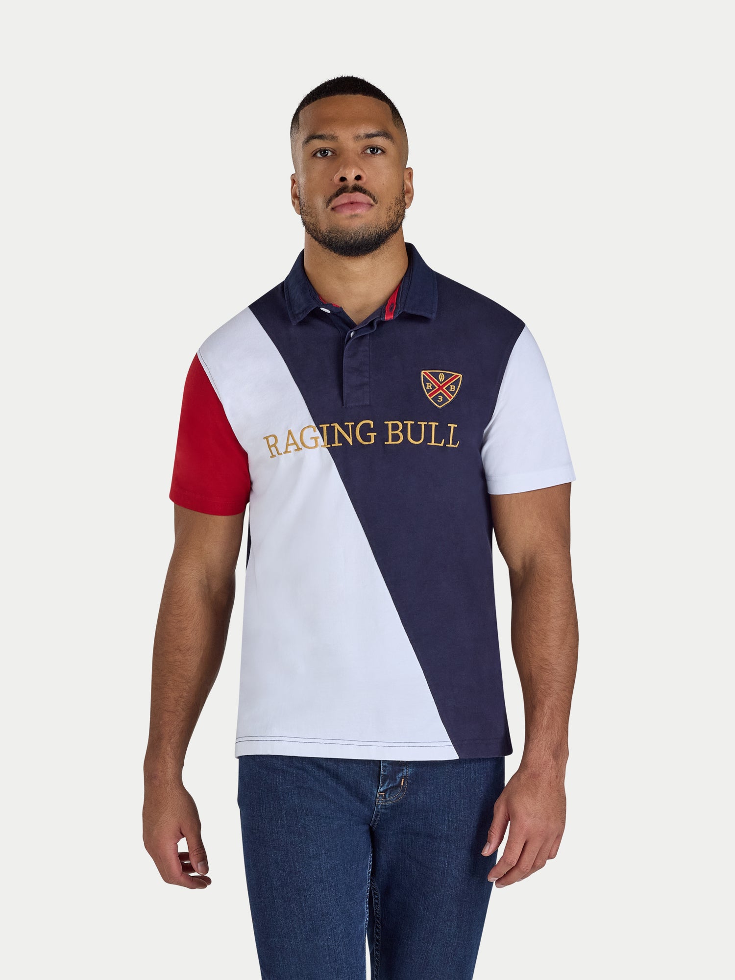 Man wearing a diagonal panel rugby top in navy.