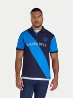 Man wearing a blue and navy striped polo shirt with 'Raging Bull' branding on a white background