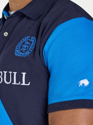 Navy and blue polo shirt with brand logos on a neutral background
