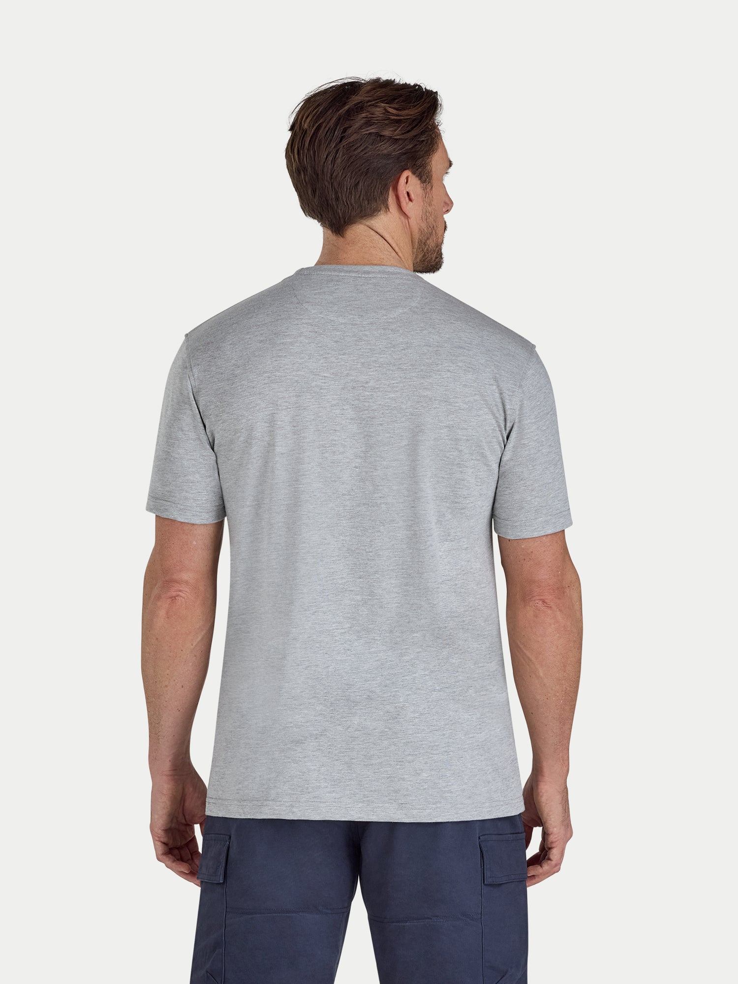 Man wearing a gray t-shirt on a white background