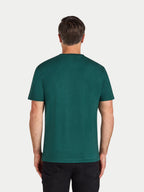 Man wearing a green t-shirt on a white background