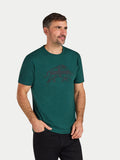 Man wearing a green t-shirt with a logo on a light gray background