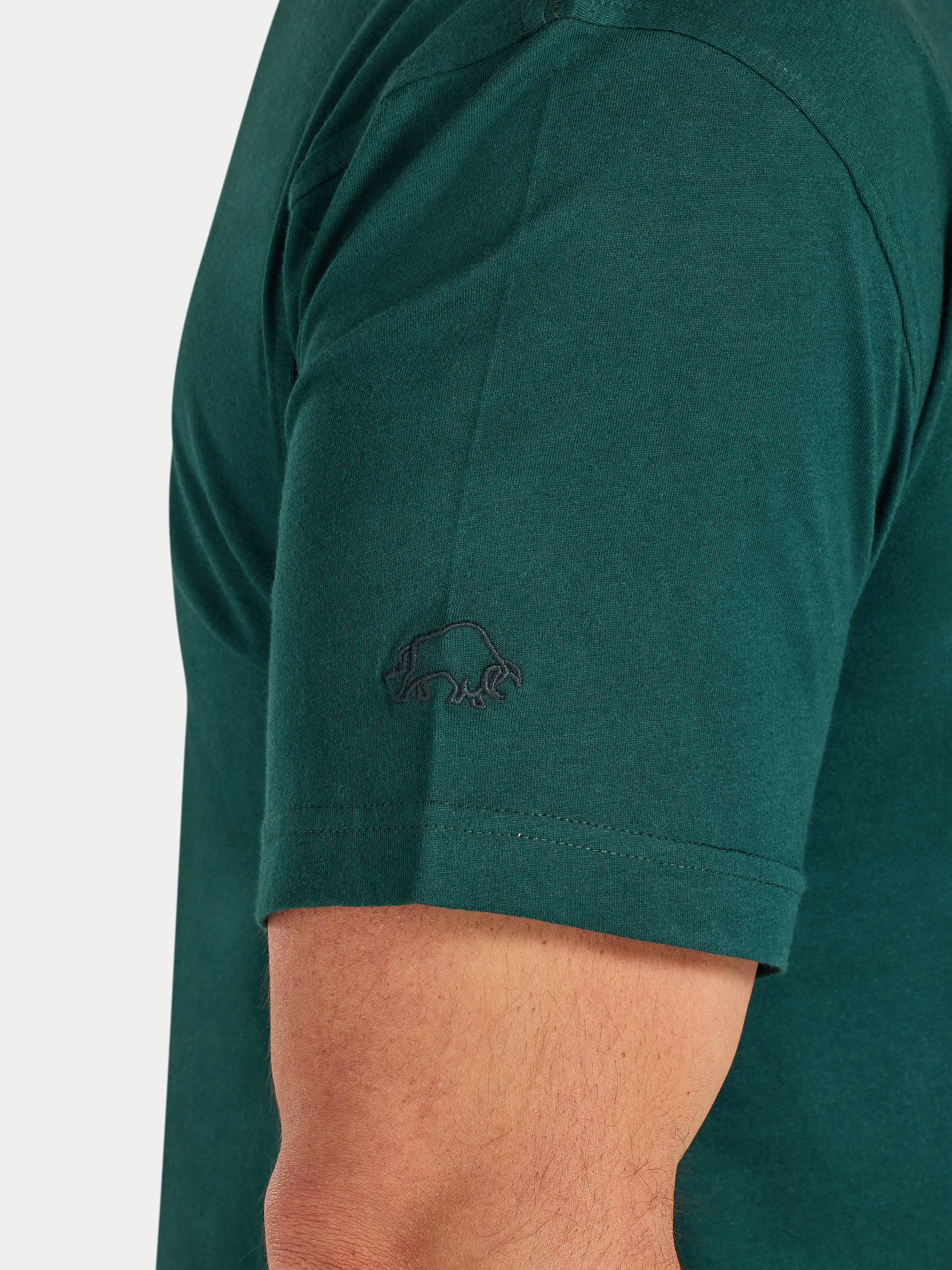 Green polo shirt with a logo on the chest area against a white background