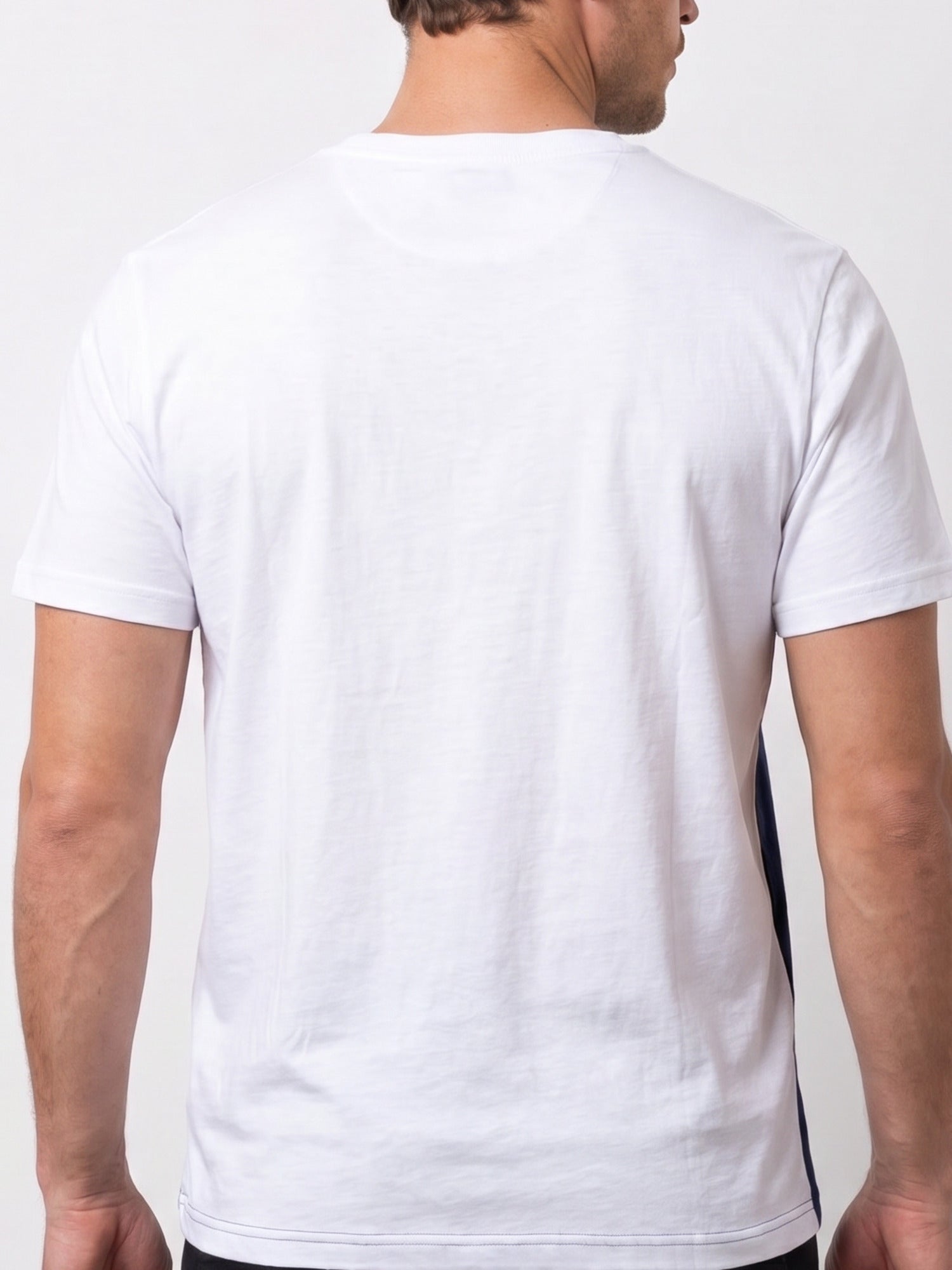 A man wearing Raging Bull Engineered stripe t-shirt, back. 
