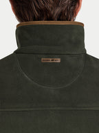 Dark green gilet with a brand logo on the collar against a white background
