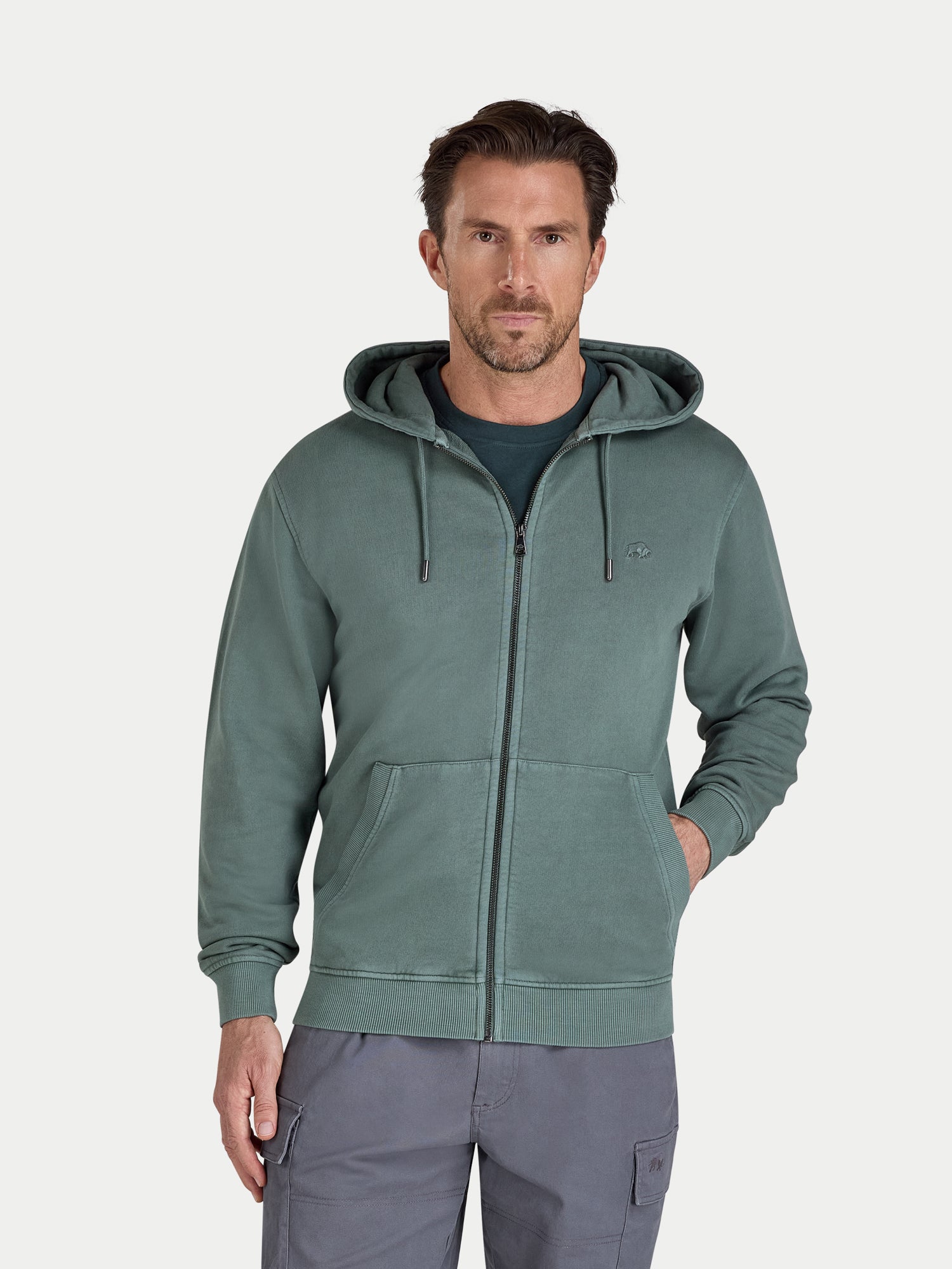 Man wearing a green hoodie on a white background