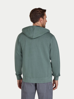Man wearing a green hoodie from behind on a white background