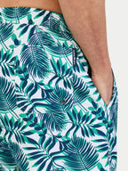 Man wearing Raging Bull Hawaiian Patterned Swim Shorts - Green, back pocket detail. 