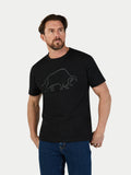 Man wearing a black t-shirt with a graphic design on a plain background