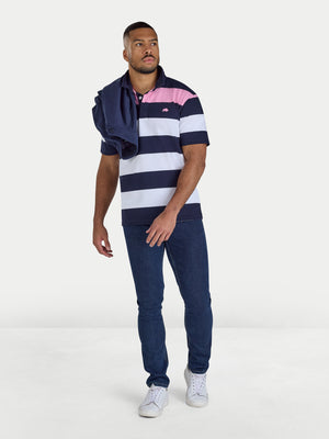 Man wearing a striped polo shirt and jeans on a white background