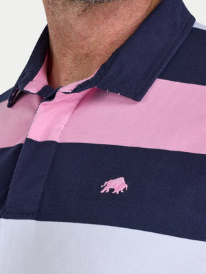 Close-up of a pink and navy striped polo shirt with a Raging Bull logo on a white background