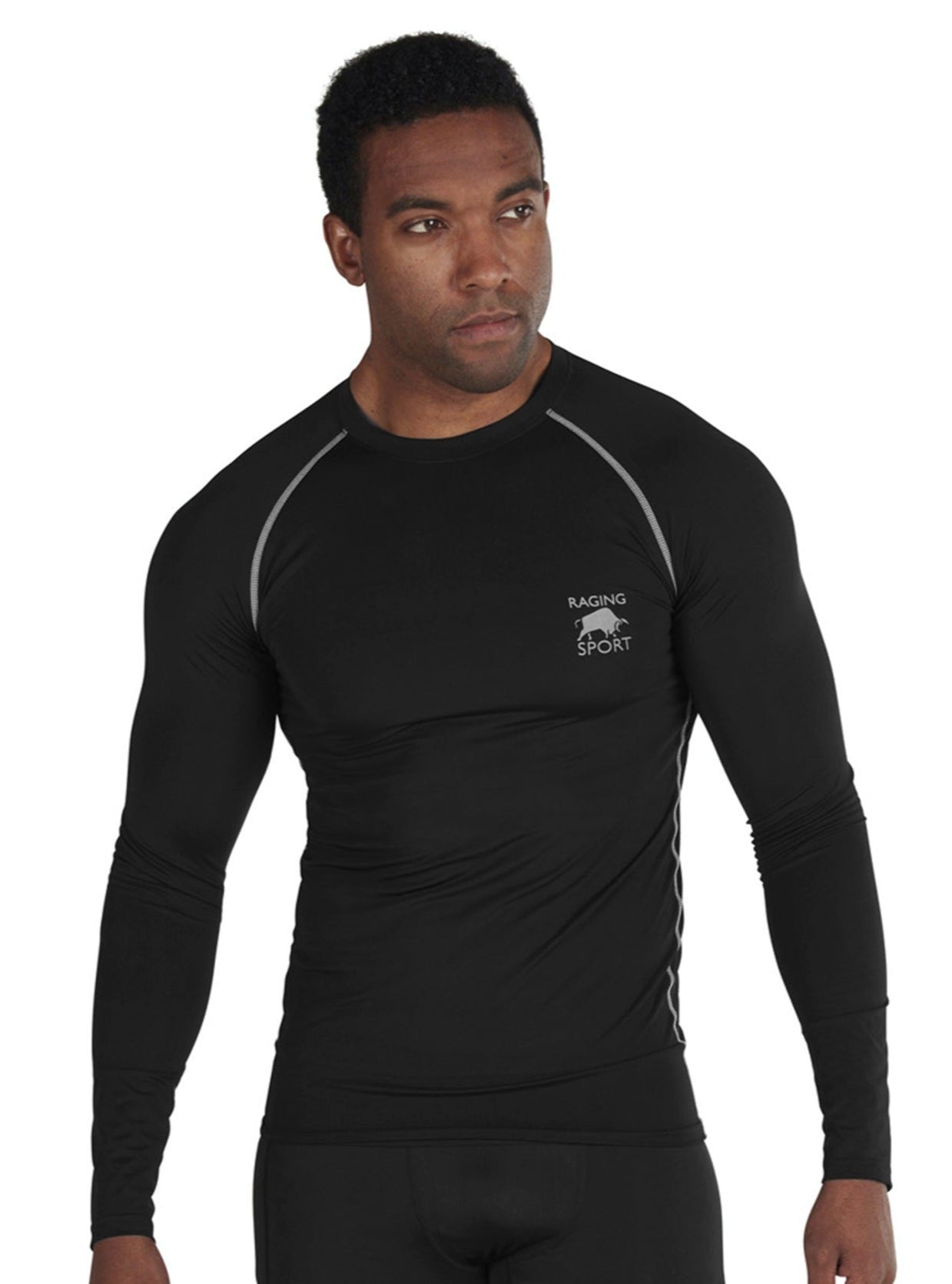 A man wearing a long sleeve black compression top with contrasting grey stitching and the Raging Bull logo on the chest.