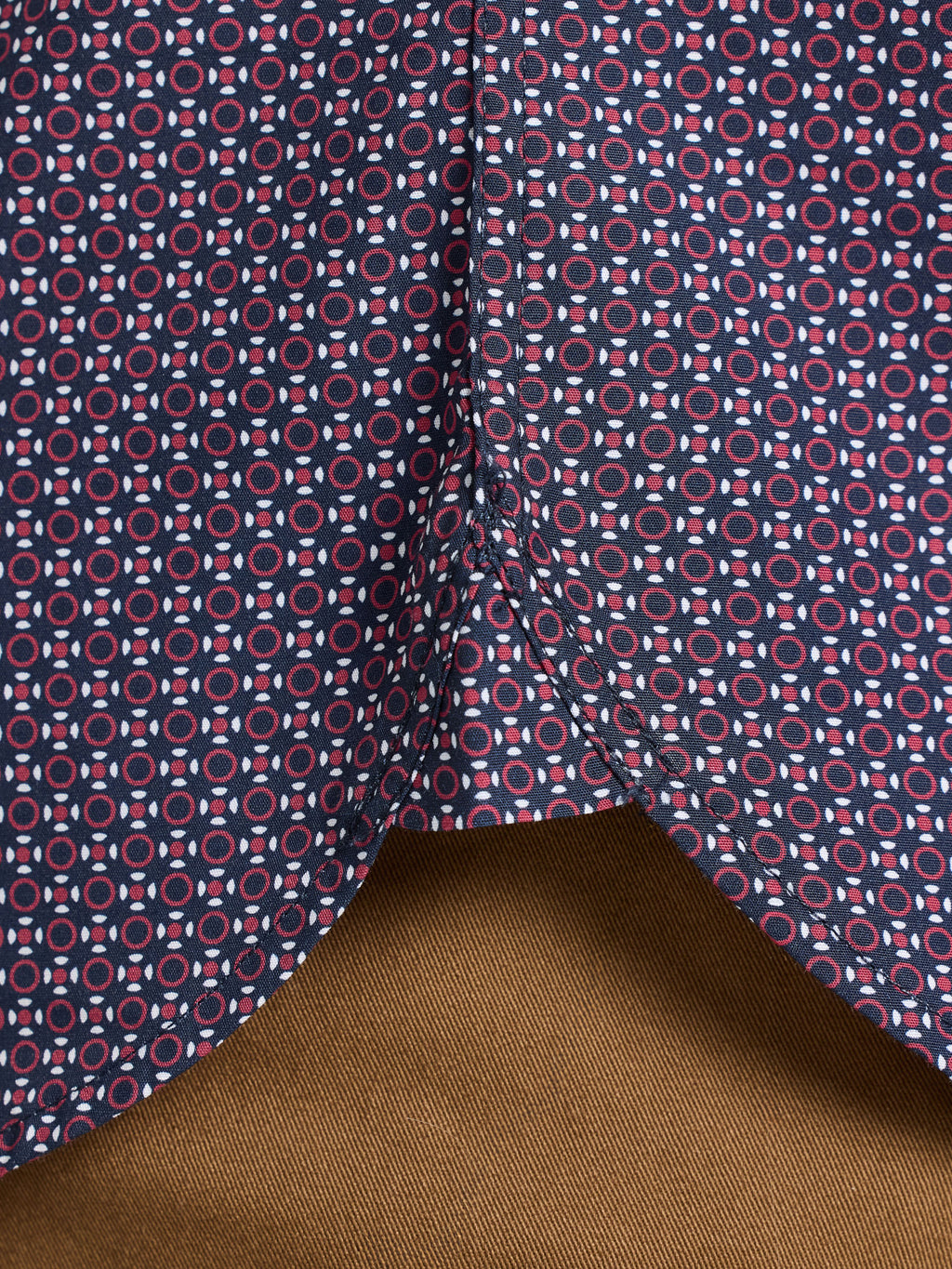 Close-up of fabric with geometric pattern on a brown background
