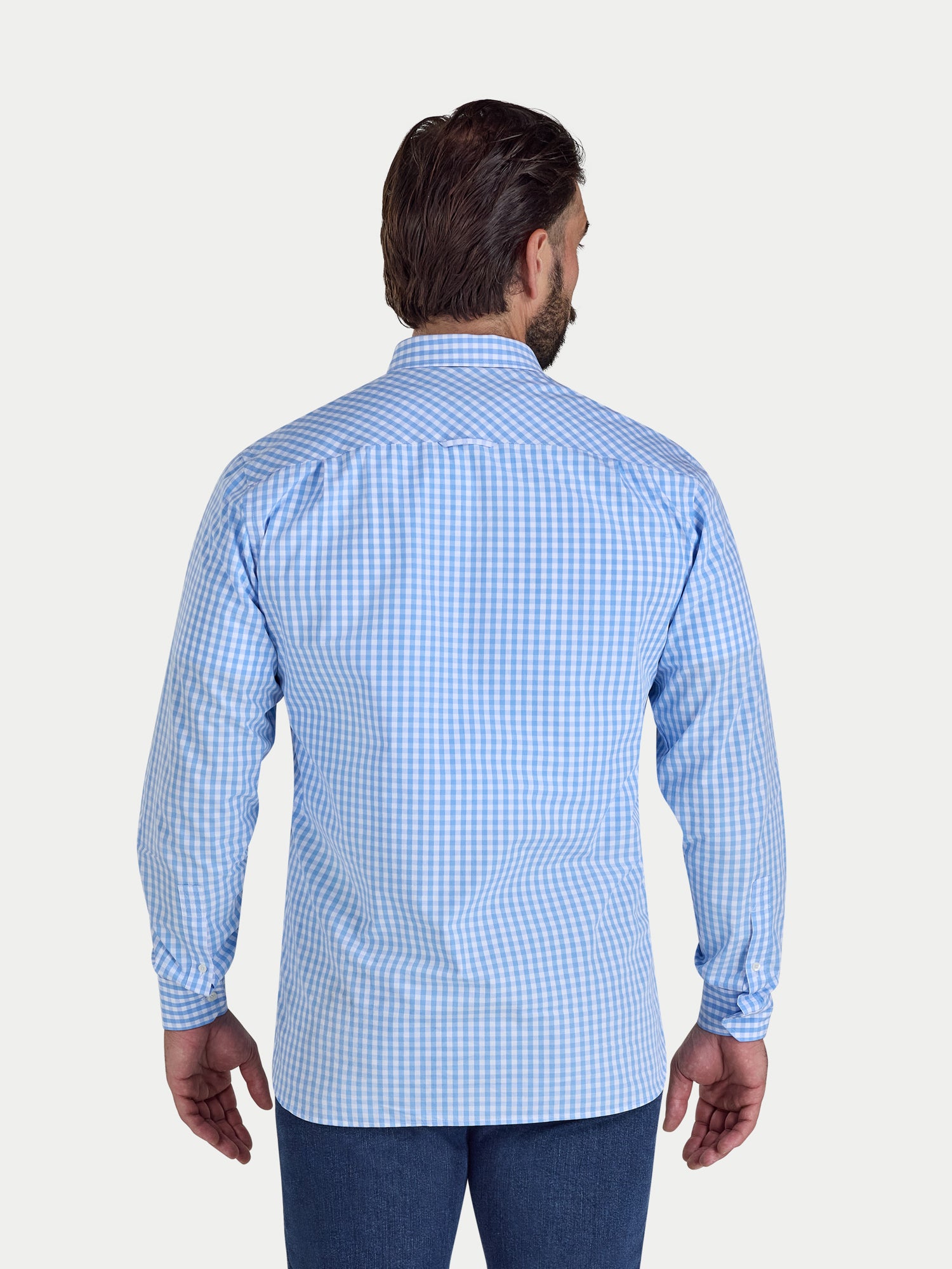 Man wearing a blue checkered shirt on a white background