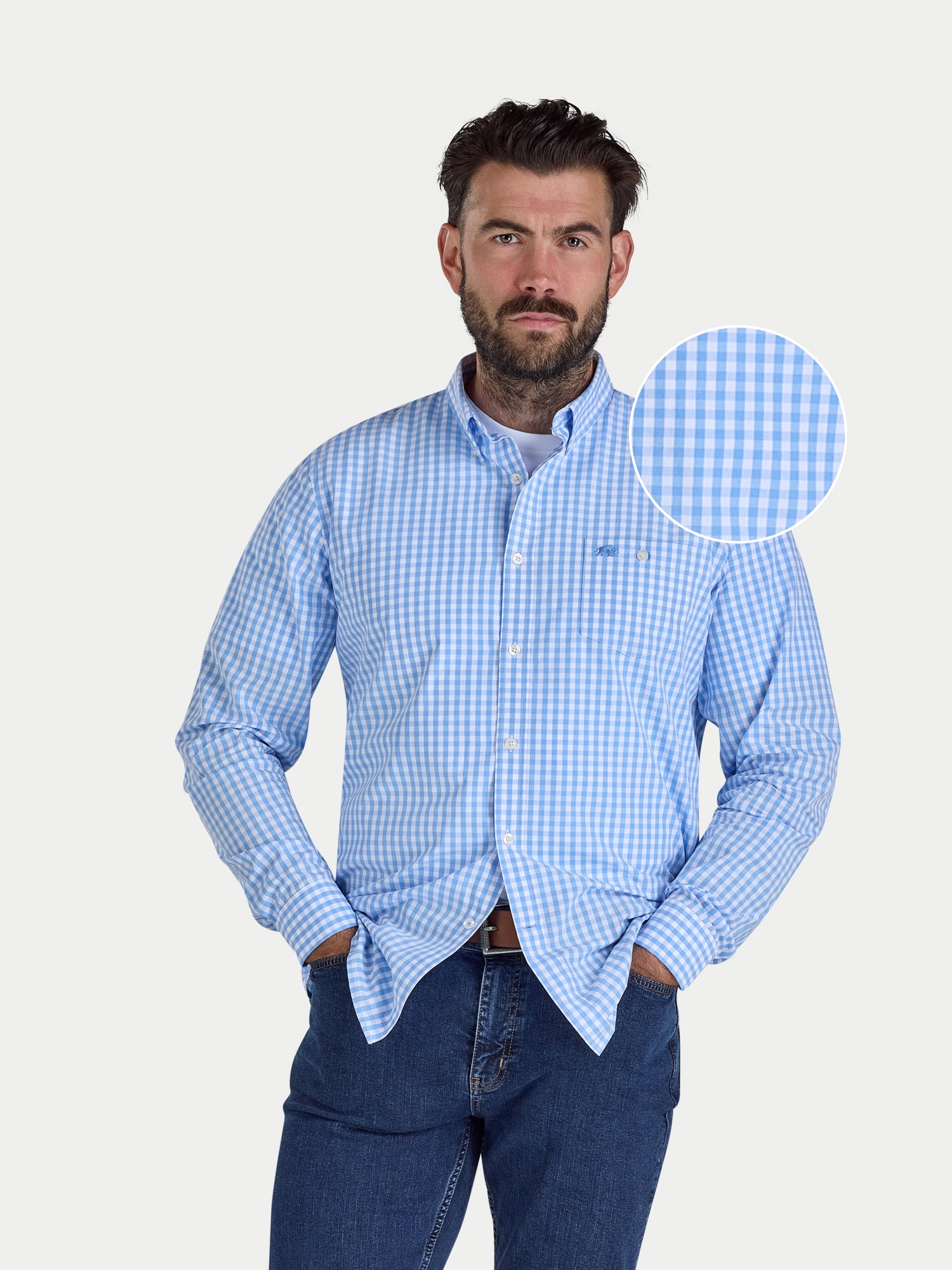 Man wearing a blue checkered shirt with a close-up of the fabric pattern on a white background