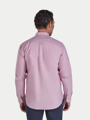 Man wearing a pink dress shirt on a white background