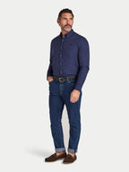 Man wearing Raging Bull Classic Oxford Long Sleeve Shirt in Navy and Regular Fit Jeans in Denim, available in sizes S-6XL