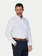 A man wearing Raging Bull Classic  Oxford Long Sleeve Shirts in White, available in sizes S-6XL.