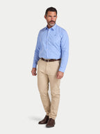 Man wearing Raging Bull Classic Stripe Long Sleeve Shirt in Mid Blue and Classic Chino Trousers in tan, available in sizes S-6XL