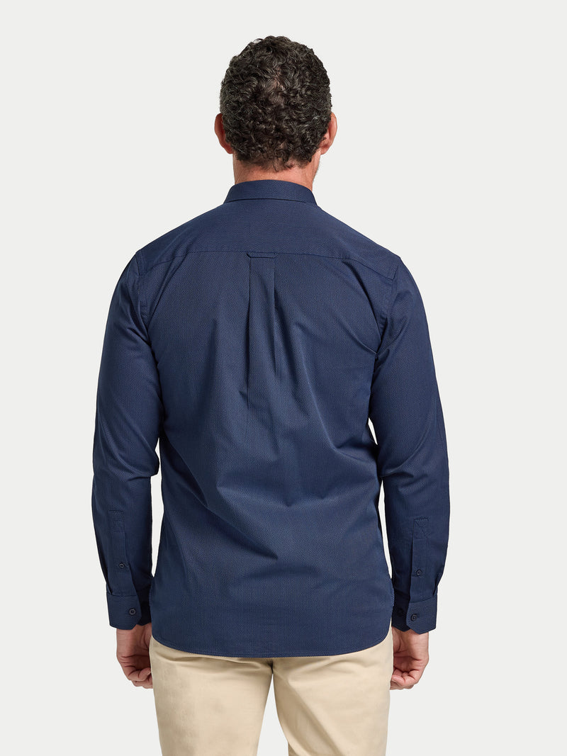 Man wearing a navy blue shirt on a white background