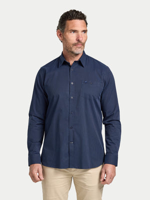 Man wearing a navy blue shirt on a white background