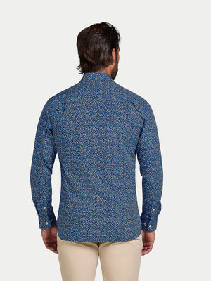 Man wearing a blue patterned shirt on a white background