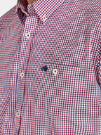 Close-up of a man wearing Raging Bull Graph Check Poplin Long Sleeve Shirt in Red and Regular Fit Jeans in Denim, available in sizes S-6XL.