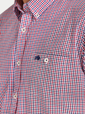 Red, white, and blue checkered shirt with a brand logo on a person wearing it.