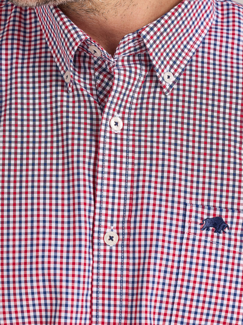Red and blue checkered shirt with a brand logo on a white background