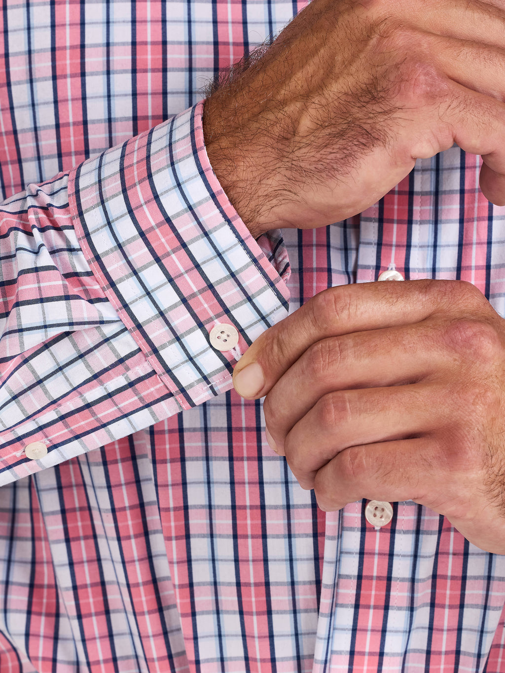 Close-up of a man wearing a Raging Bull Large Check Cotton Poplin Long Sleeve Shirt in Pink, available in sizes S-6XL