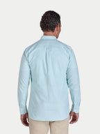 Man wearing a light blue striped shirt on a white background