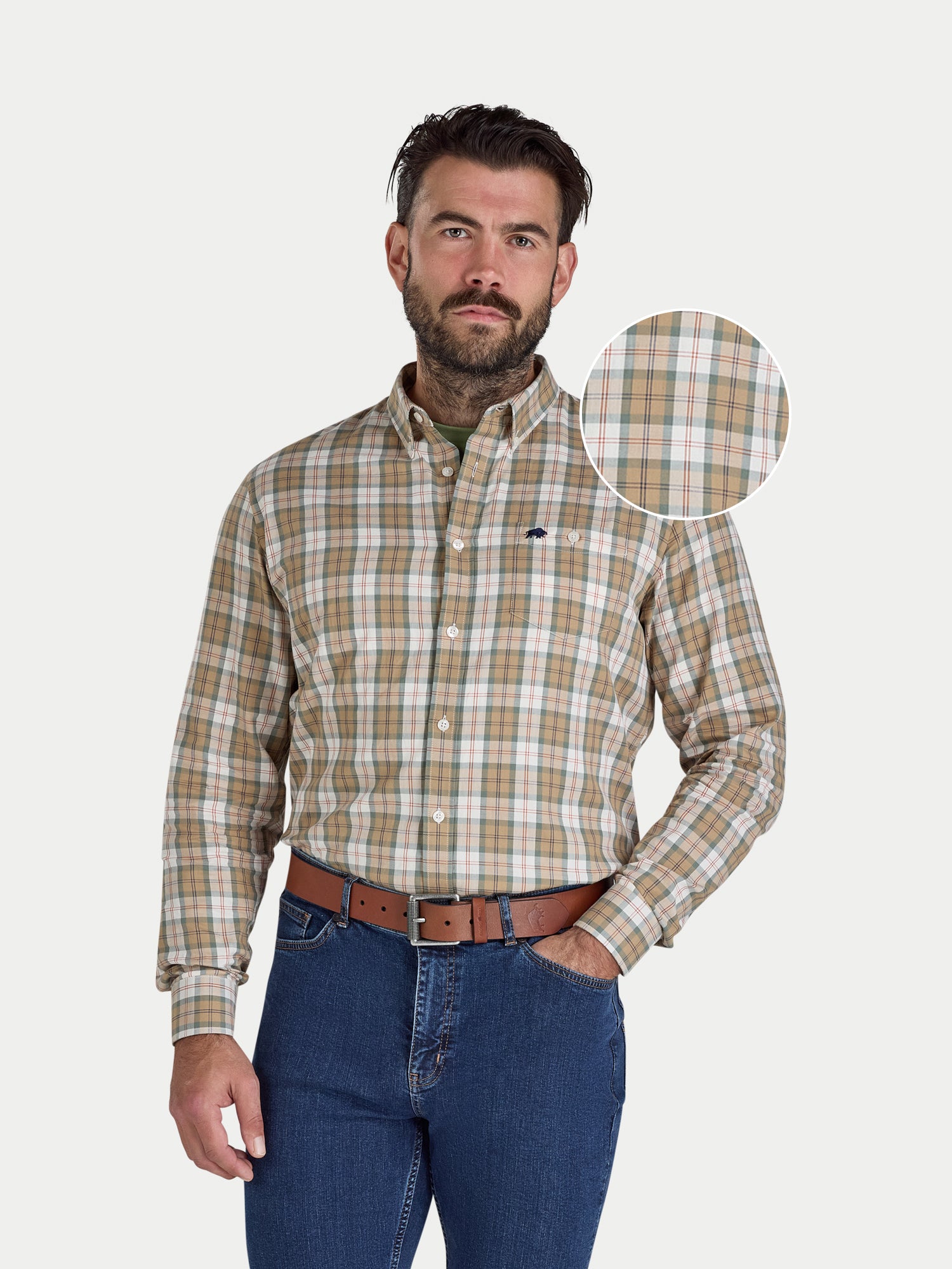 Man wearing Raging Bull long sleeve Suffolk check twill shirt in tan, front detail. 