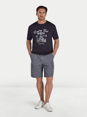 Man wearing a black t-shirt with a graphic design and gray shorts on a white background