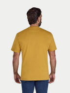 Man wearing a mustard yellow t-shirt on a white background